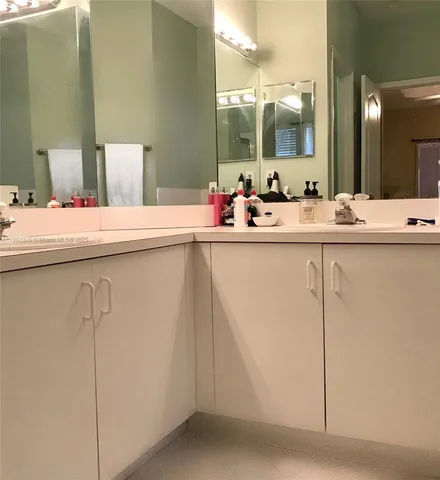 a bathroom with a sink and mirror