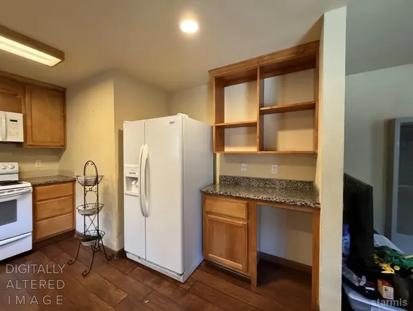 a kitchen with a refrigerator stove and sink