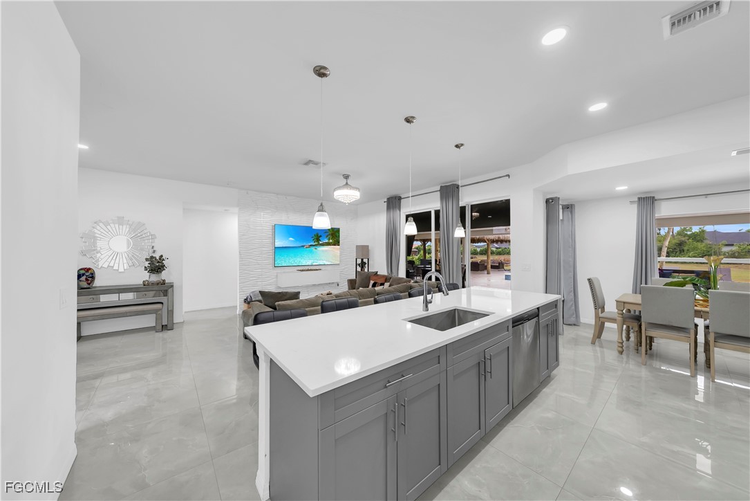 7881 Buckingham Road Fort Myers, FL 33905 - Photo 13 of 49 a kitchen with sink stove and cabinets