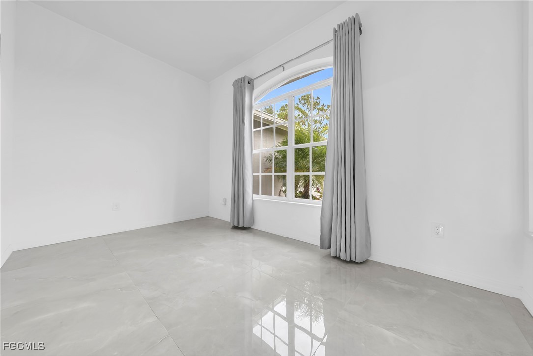 7881 Buckingham Road Fort Myers, FL 33905 - Photo 24 of 49 an empty room with windows
