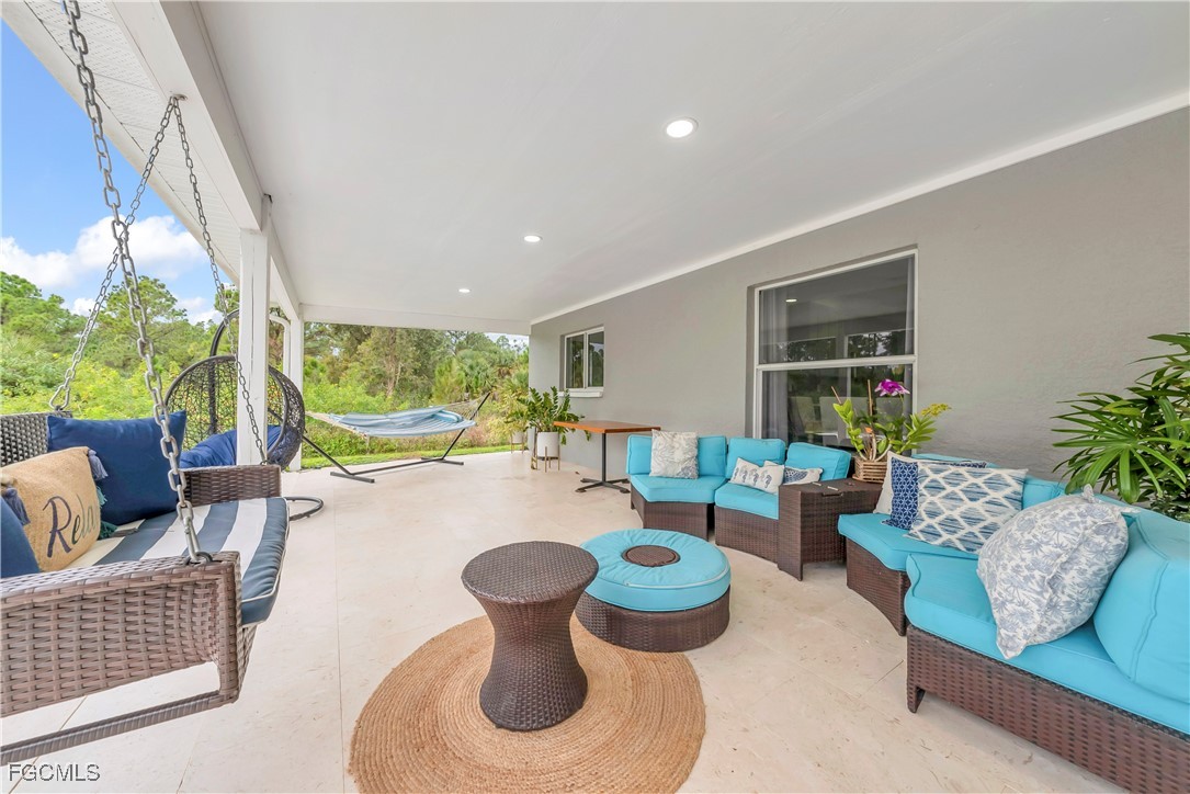 7881 Buckingham Road Fort Myers, FL 33905 - Photo 26 of 49 a living room with furniture and a large window