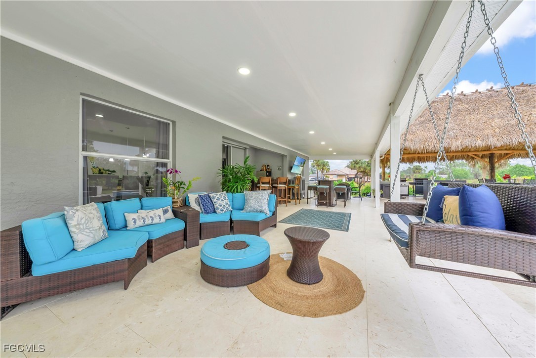 7881 Buckingham Road Fort Myers, FL 33905 - Photo 27 of 49 a living room with furniture and a large window