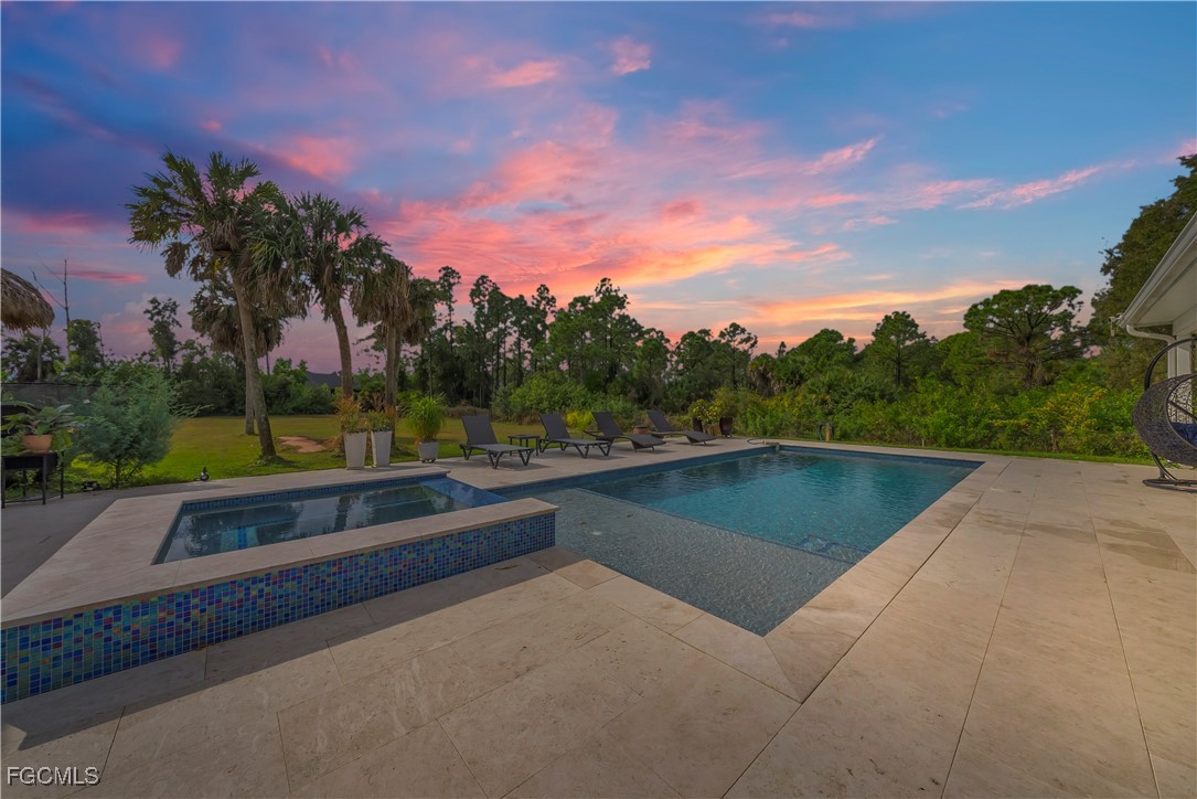 7881 Buckingham Road Fort Myers, FL 33905 - Photo 3 of 49 a view of swimming pool with a yard