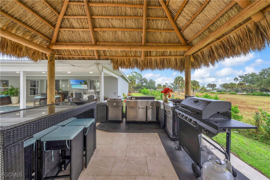 7881 Buckingham Road Fort Myers, FL 33905 - Photo 33 of 49 a view of a kitchen with a stove and a table