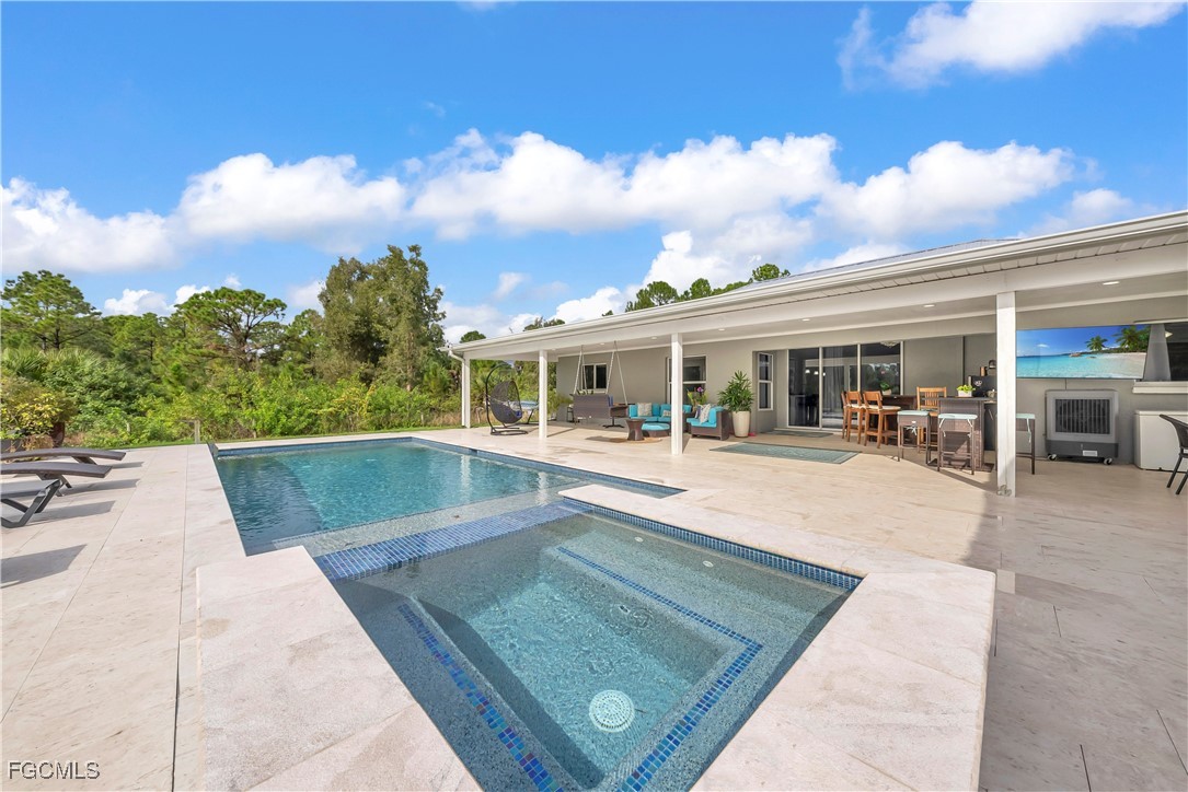7881 Buckingham Road Fort Myers, FL 33905 - Photo 38 of 49 a view of house with swimming pool and sitting area