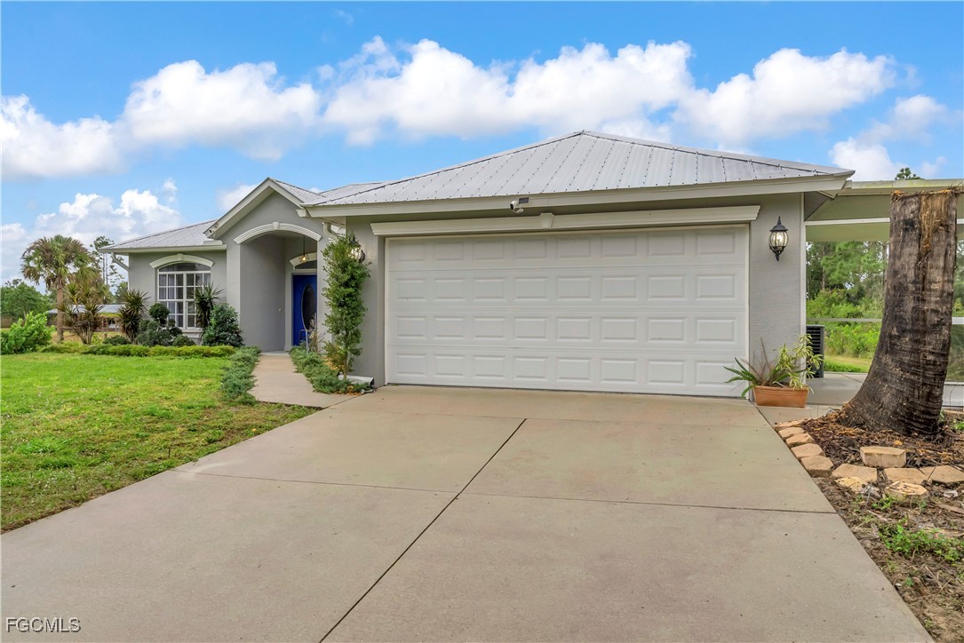7881 Buckingham Road Fort Myers, FL 33905 - Photo 43 of 49 a front view of house with yard
