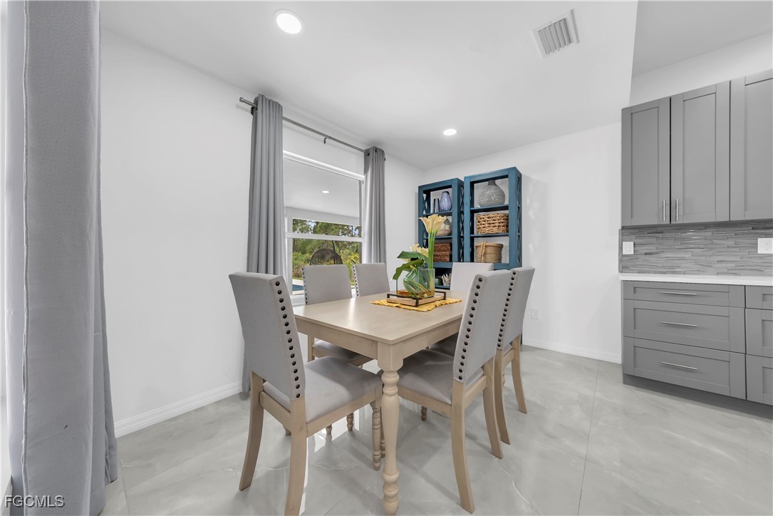 7881 Buckingham Road Fort Myers, FL 33905 - Photo 9 of 49 a view of a dining room with furniture and window