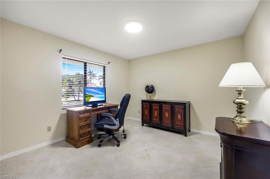 2383 Mayfield Court, Unit 4 Naples, FL 34105 - Photo 14 of 21 a workspace with furniture and a window