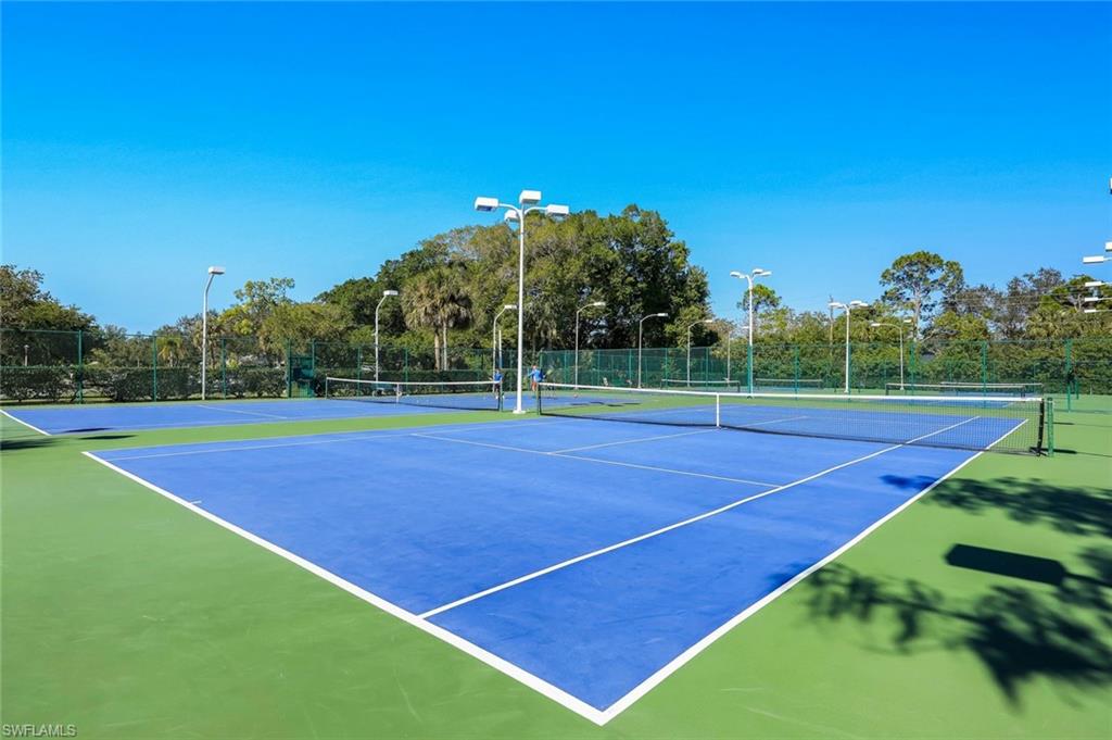 2383 Mayfield Court, Unit 4 Naples, FL 34105 - Photo 20 of 21 a view of an outdoor space and tennis court