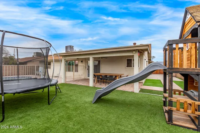 a view of a house with a back yard