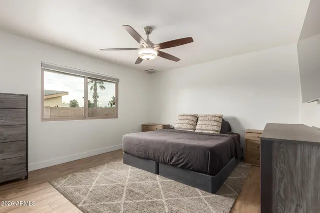 a bedroom with a bed and window