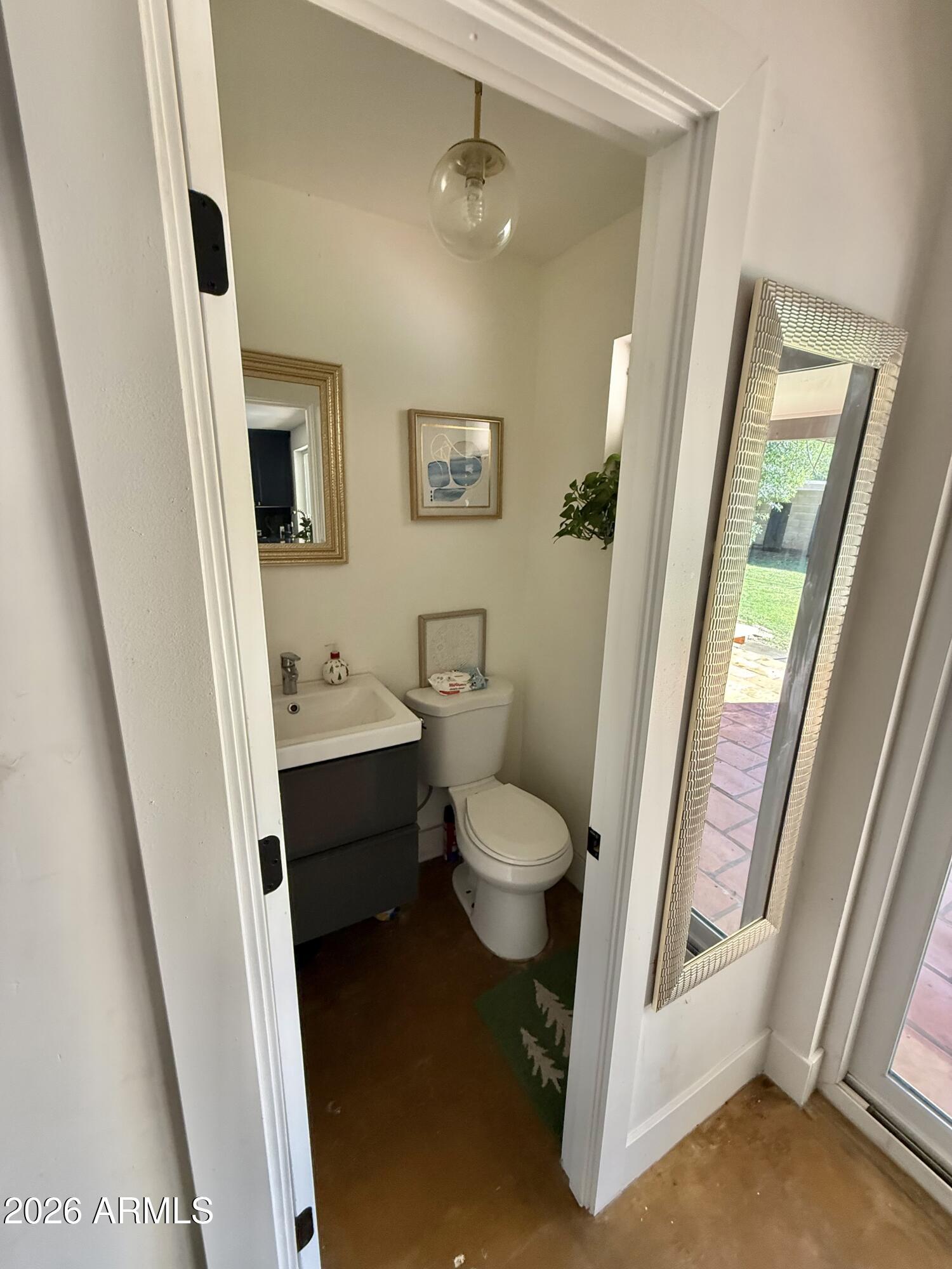225 West Alice Avenue Phoenix, AZ 85021 - Photo 15 of 29 a bathroom with a toilet sink and a mirror