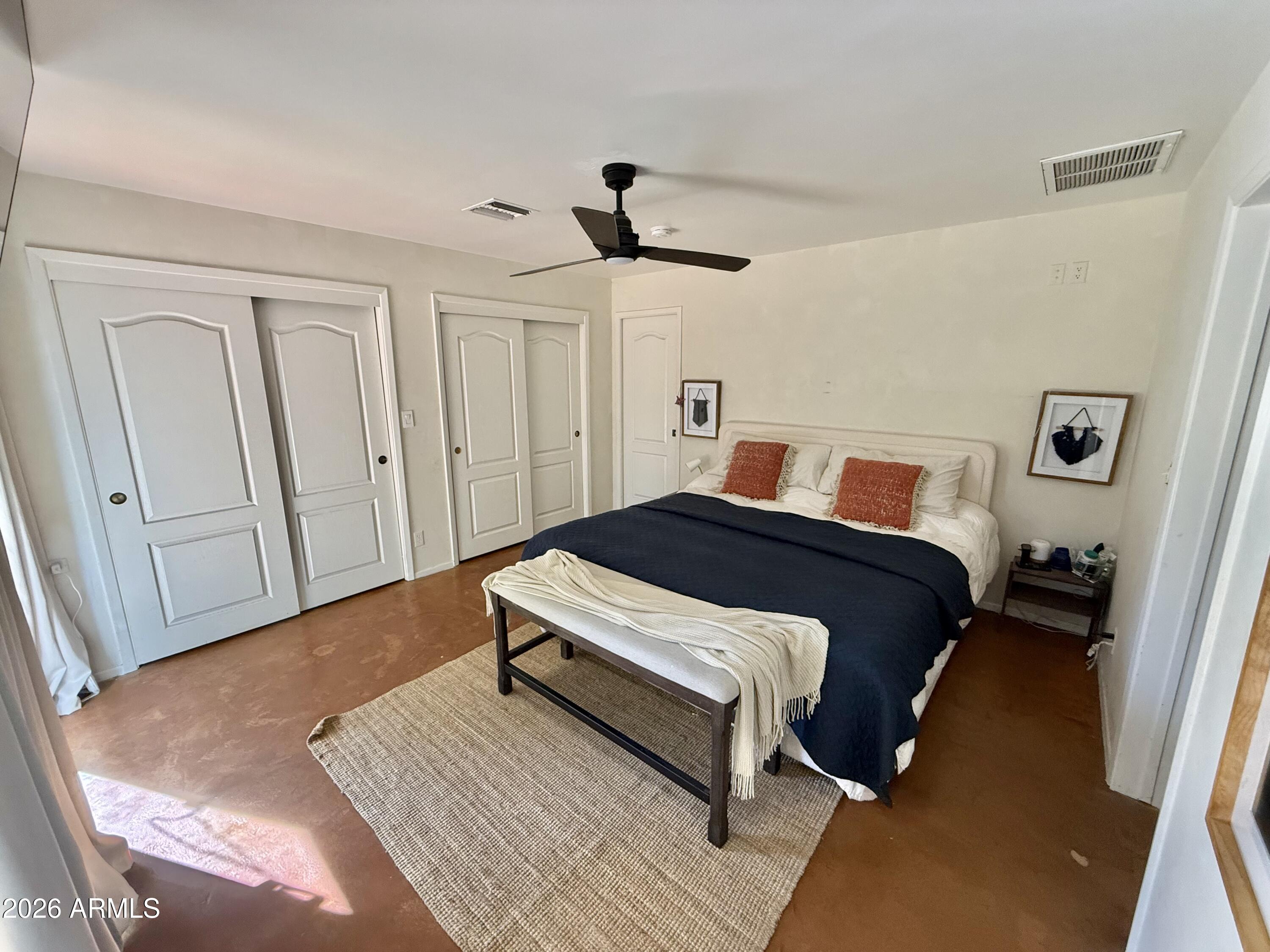 225 West Alice Avenue Phoenix, AZ 85021 - Photo 16 of 29 a bedroom with a bed and wooden floor