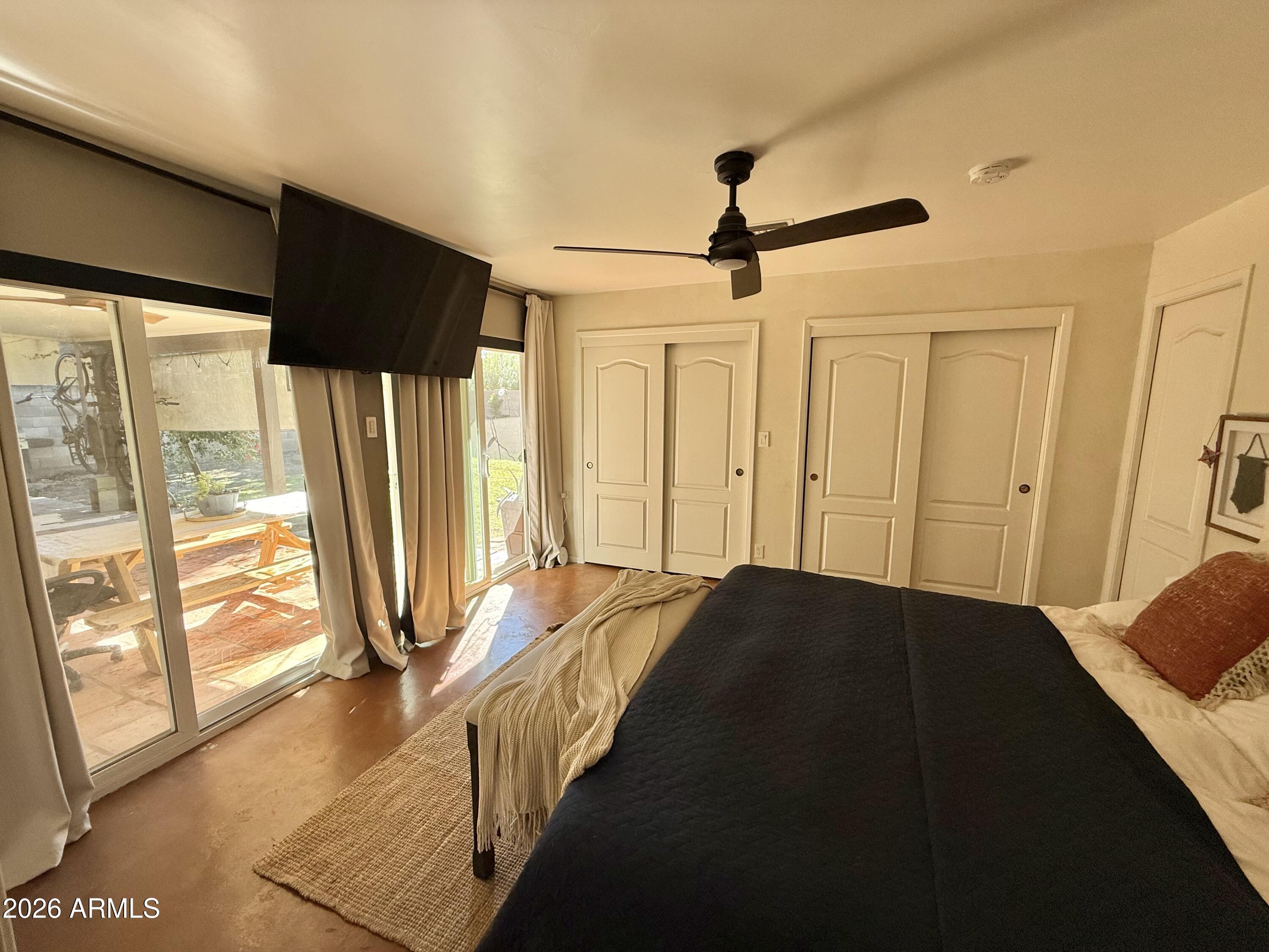 225 West Alice Avenue Phoenix, AZ 85021 - Photo 17 of 29 a view of a bedroom with wooden floor and windows