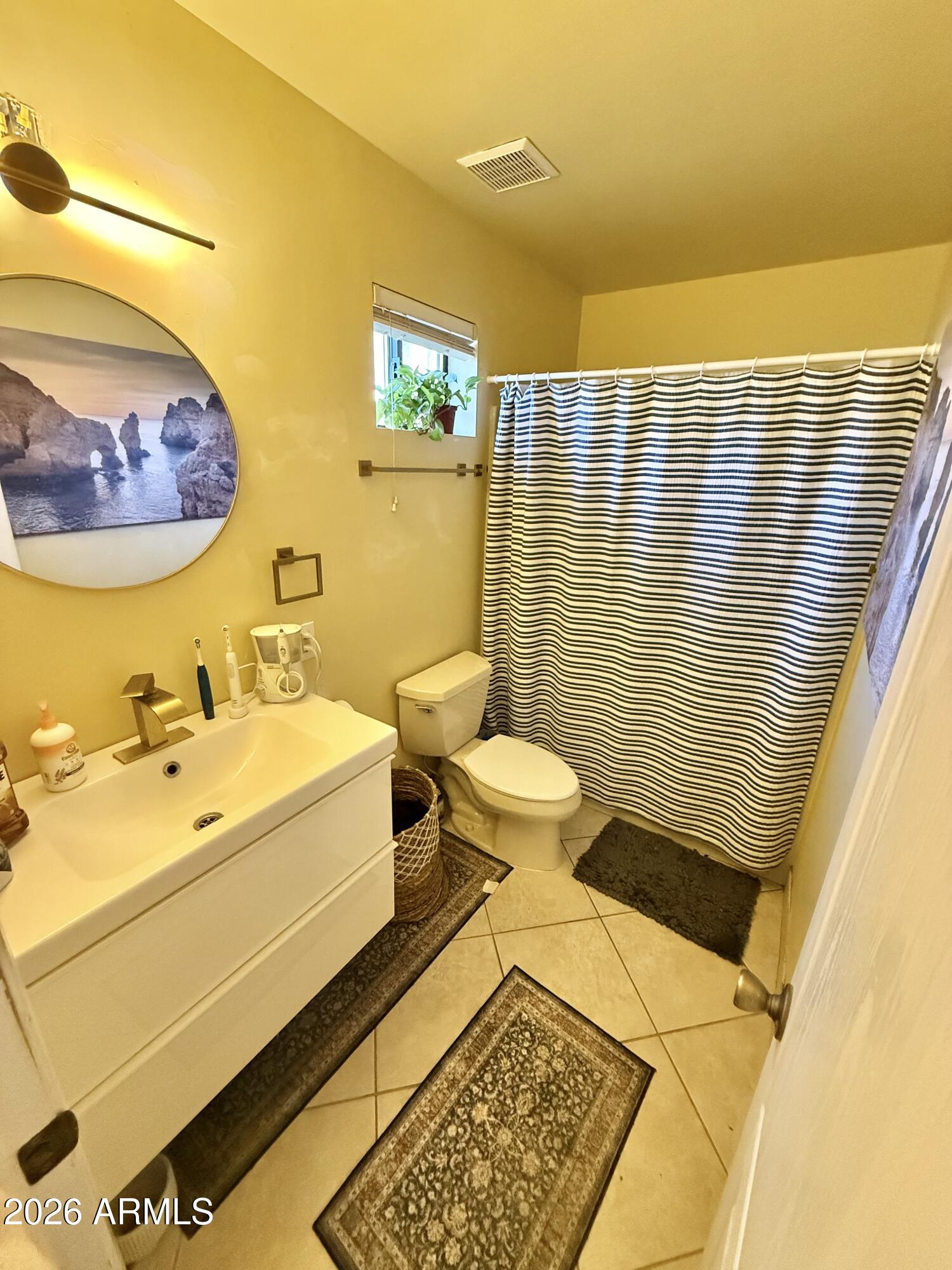 225 West Alice Avenue Phoenix, AZ 85021 - Photo 21 of 29 a bathroom with a sink and a mirror