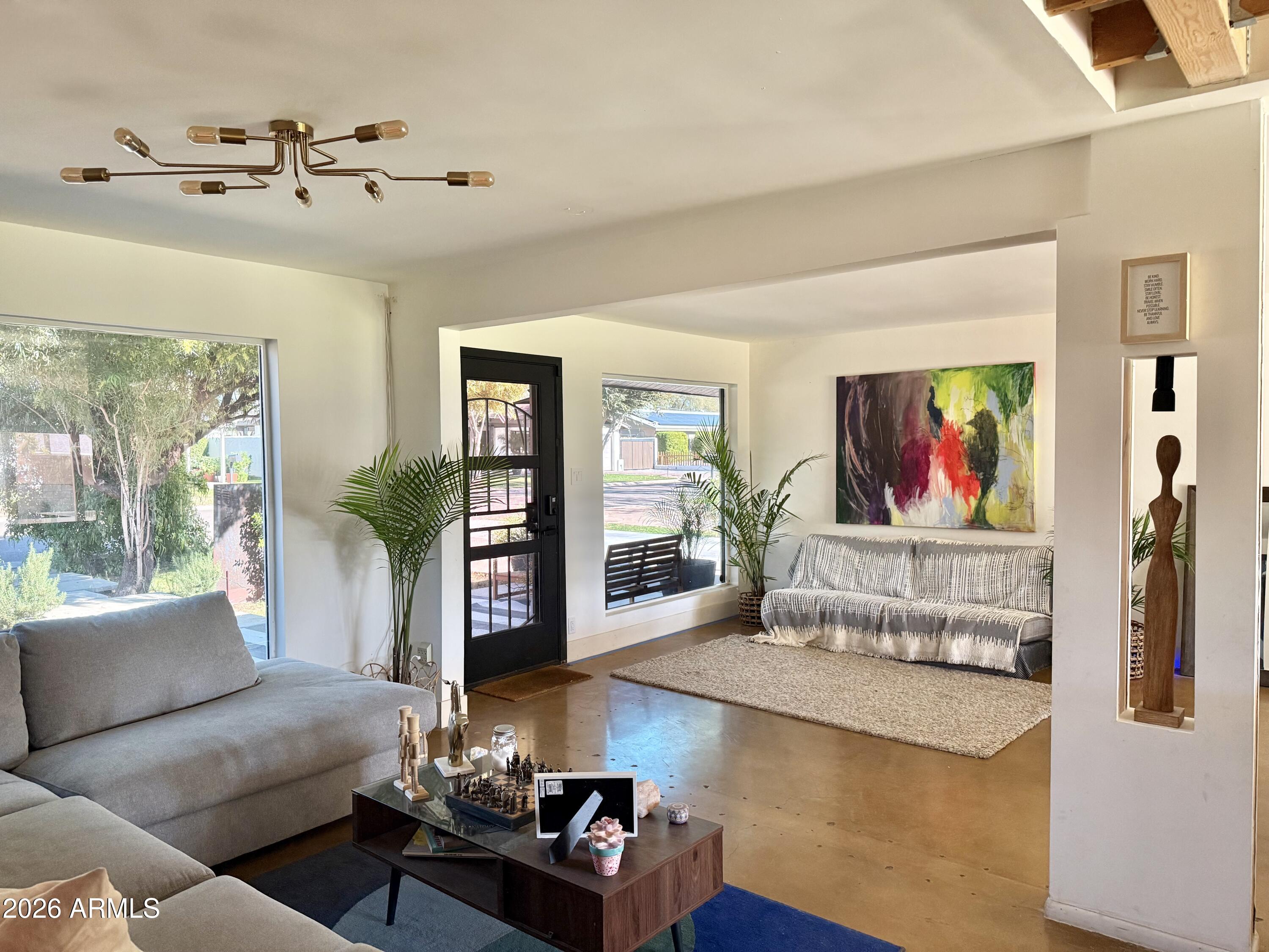 225 West Alice Avenue Phoenix, AZ 85021 - Photo 23 of 29 a living room with furniture and a flat screen tv