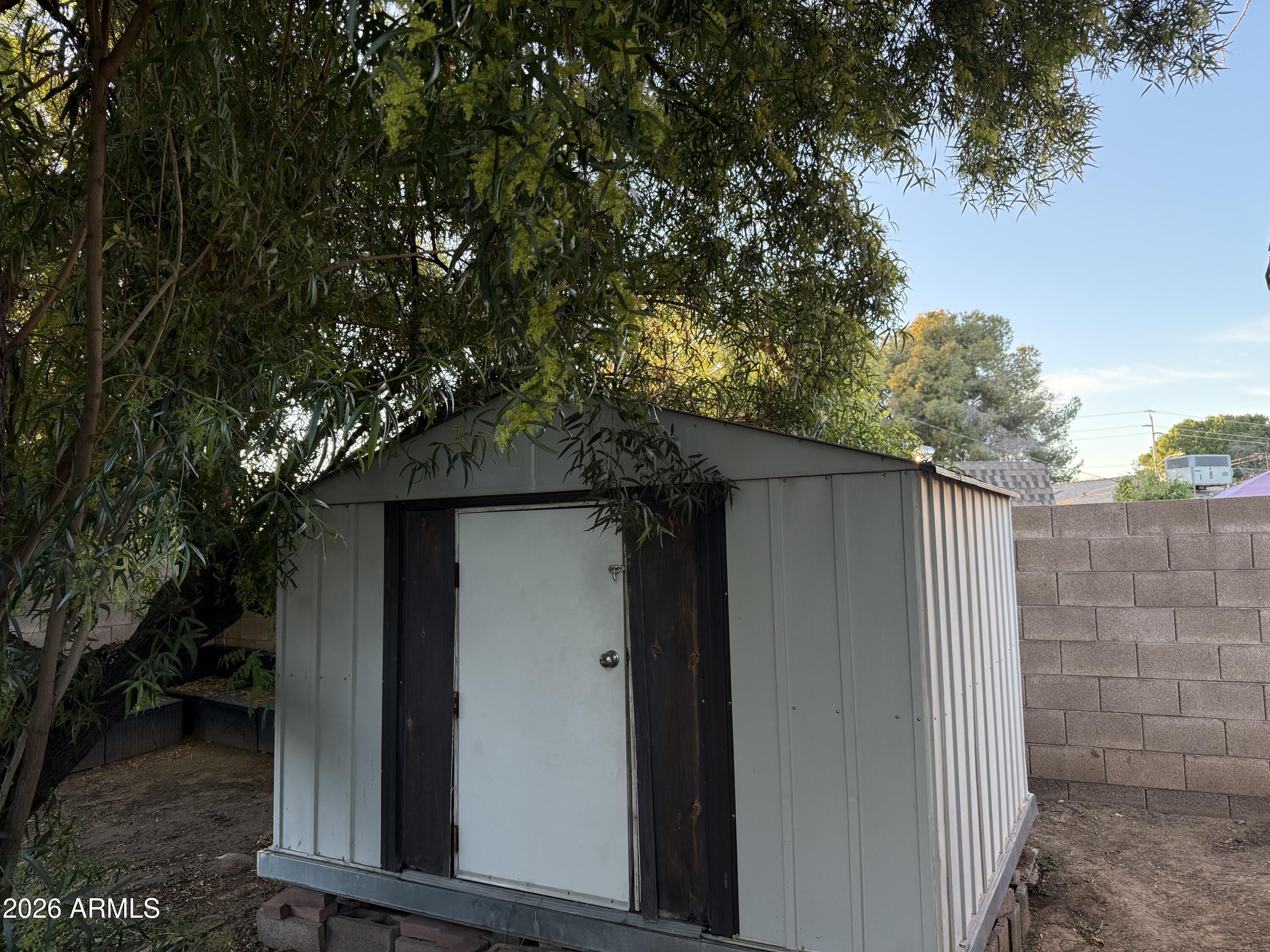 225 West Alice Avenue Phoenix, AZ 85021 - Photo 29 of 29 a wooden door in front of a house