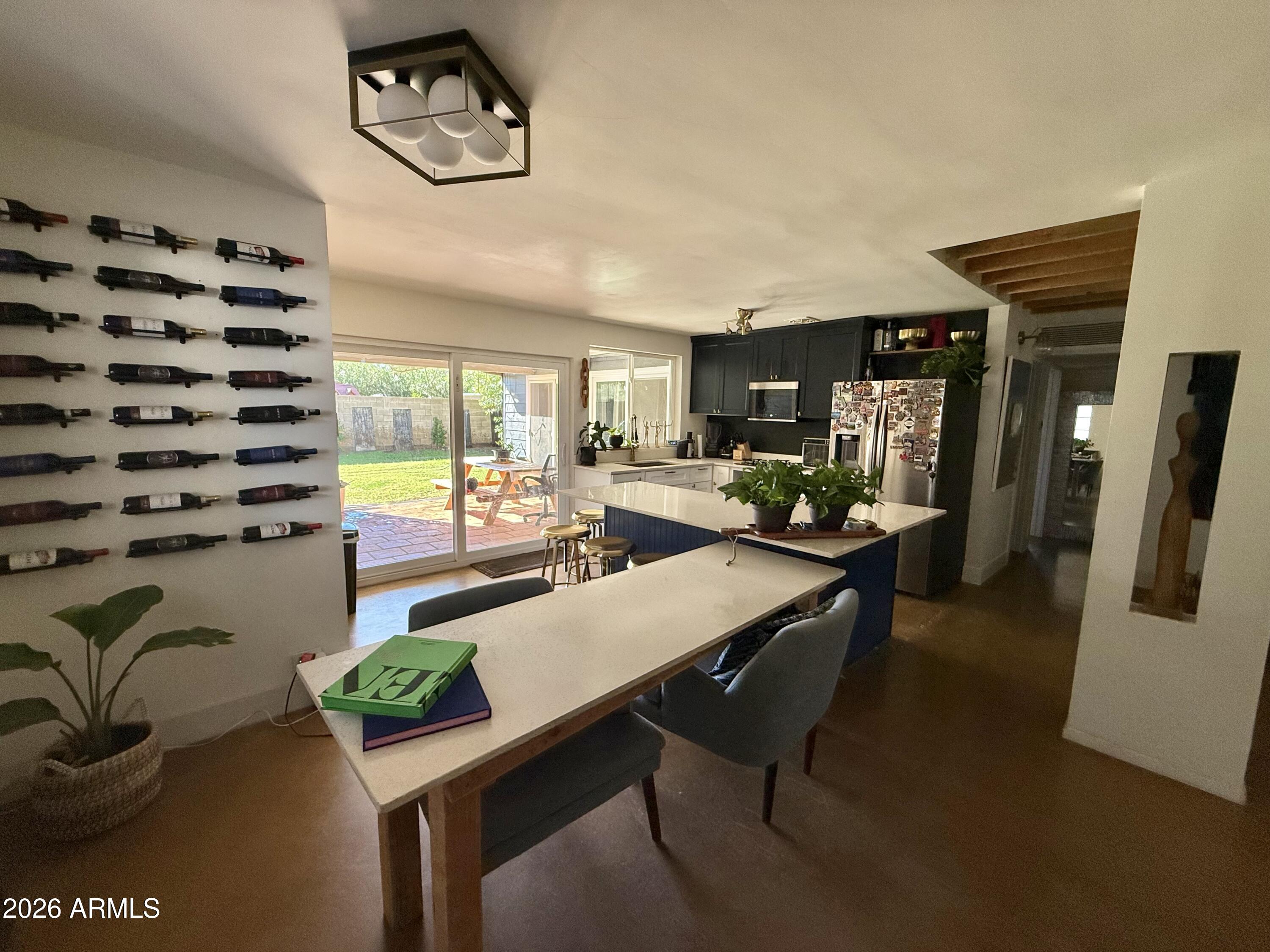225 West Alice Avenue Phoenix, AZ 85021 - Photo 6 of 29 a dining room with furniture and a floor to ceiling window