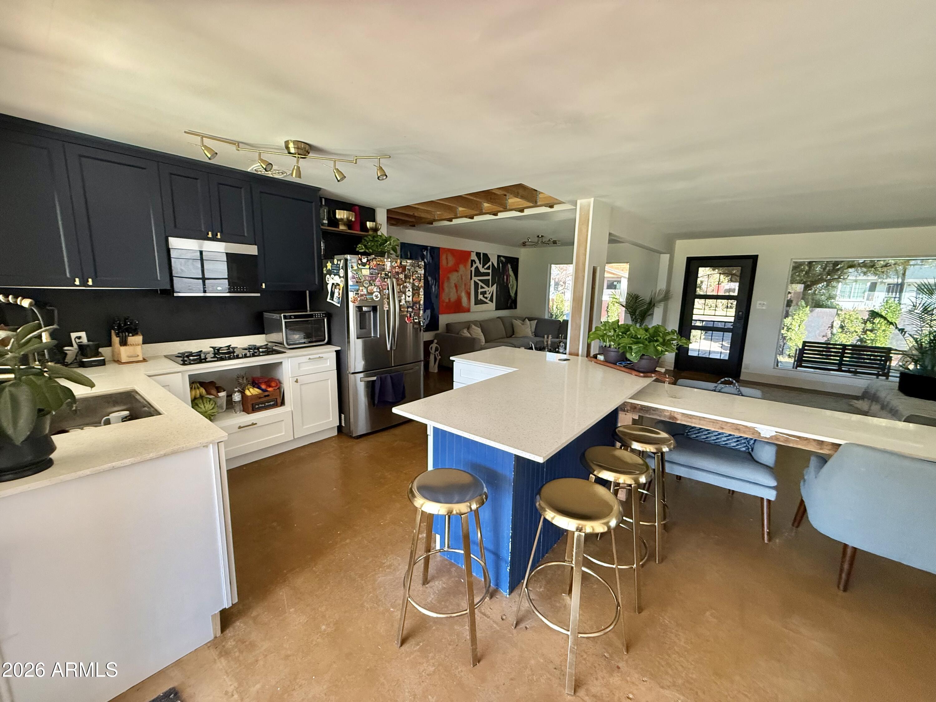 225 West Alice Avenue Phoenix, AZ 85021 - Photo 9 of 29 a kitchen with a table and chairs in it