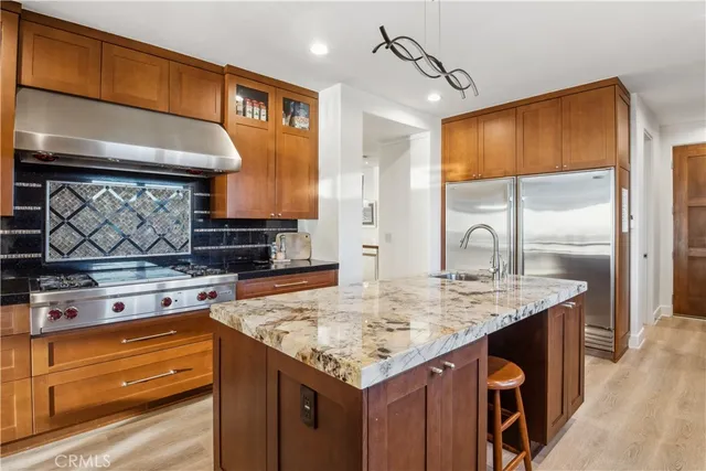 a living room with fireplace furniture and a large window