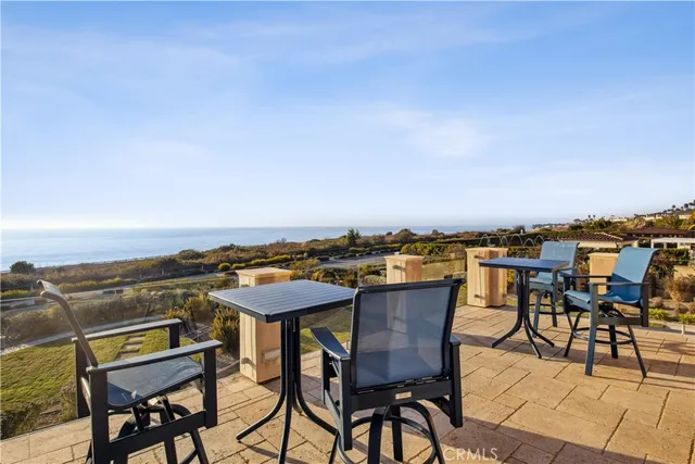 a view of a chairs and table on the terrace