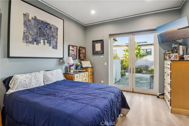 a bedroom with a bed and a book shelf