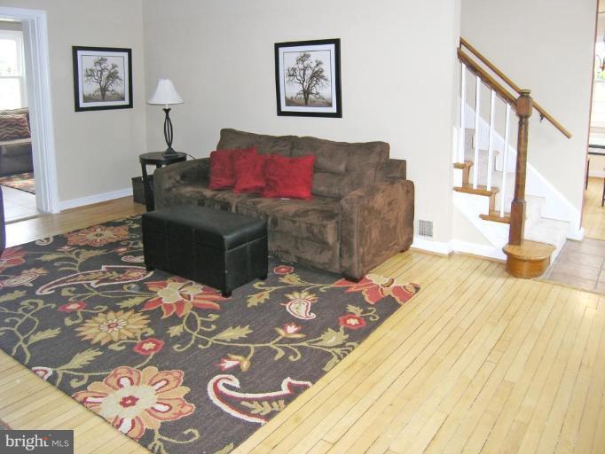 8800 Reading Road Silver Spring, MD 20901 - Photo 3 of 25 a living room with furniture and painting on the wall