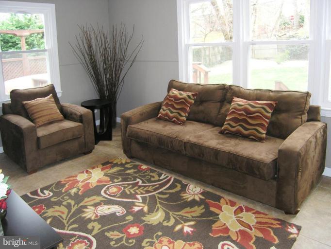 8800 Reading Road Silver Spring, MD 20901 - Photo 8 of 25 a living room with furniture and a large window