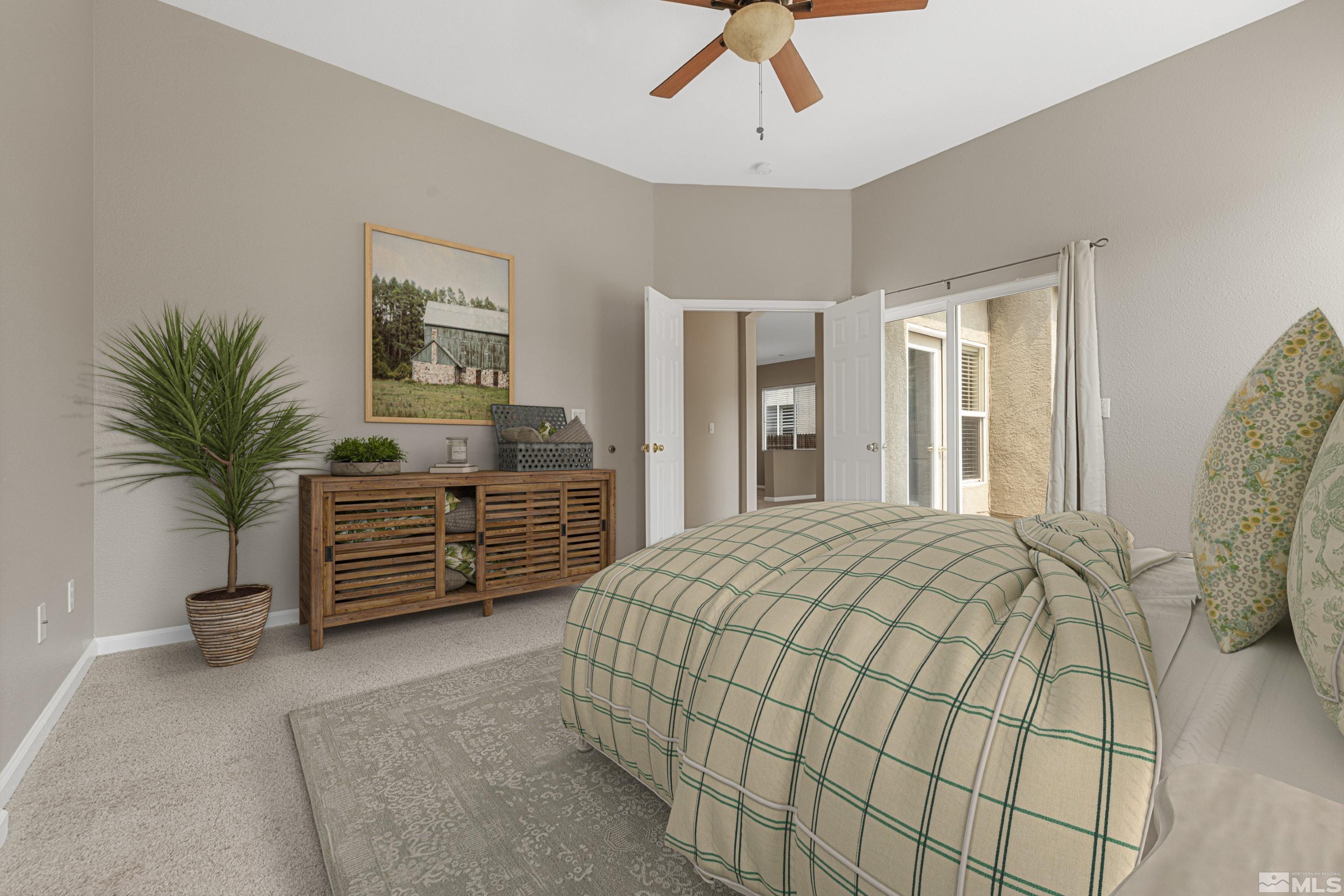 10280 Wolf Ridge Way Reno, NV 89521 - Photo 16 of 19 a bedroom with a bed and a chandelier