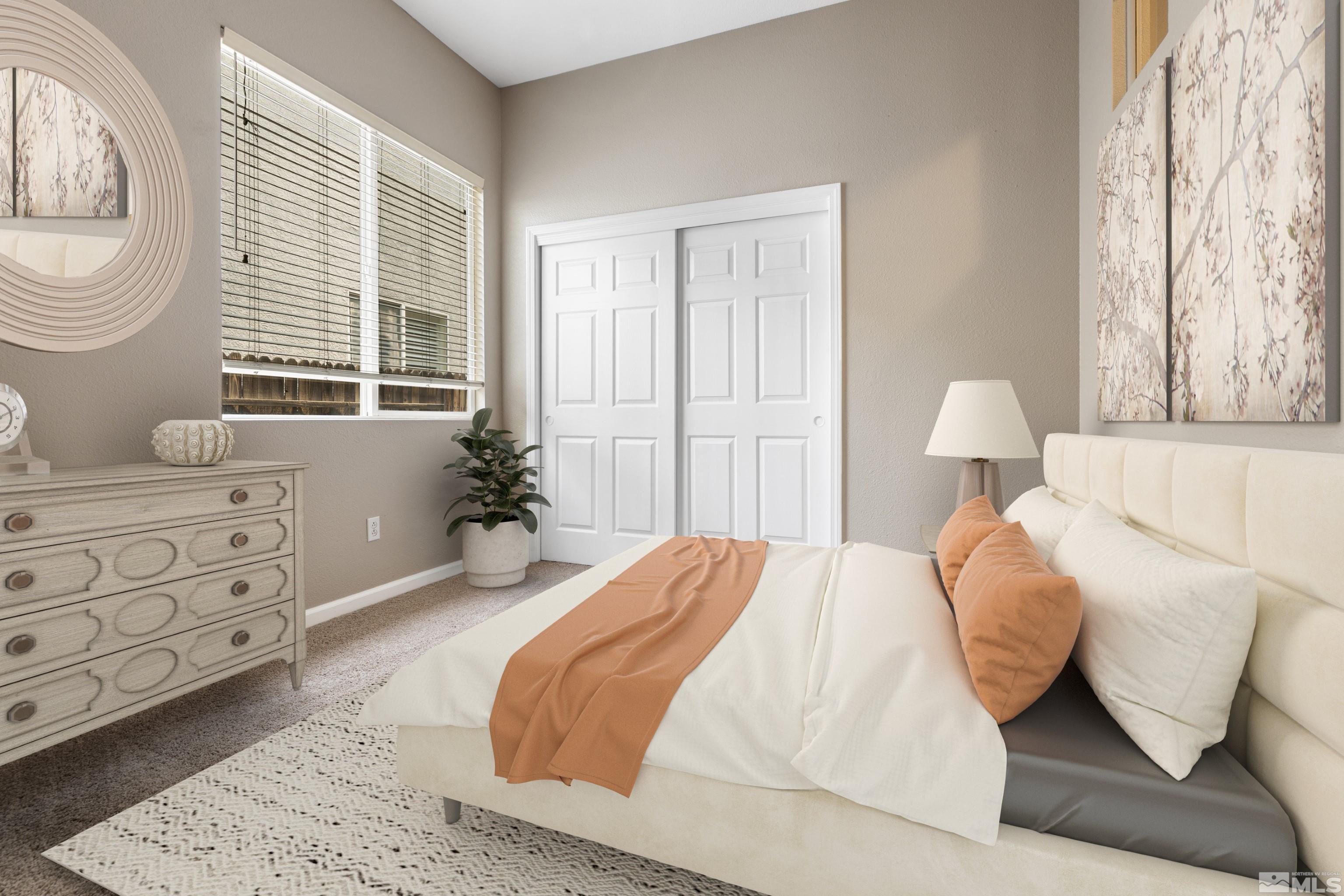 10280 Wolf Ridge Way Reno, NV 89521 - Photo 8 of 19 a bedroom with a bed and window
