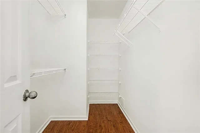 a view of a small space with wooden floor