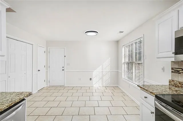 a view of an empty room and window