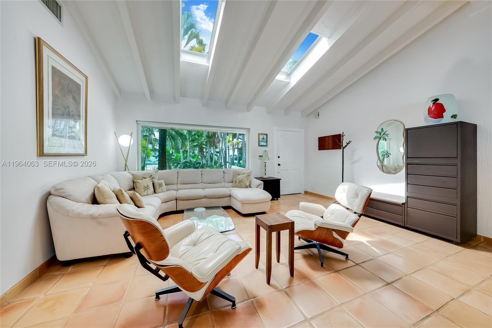 278 South Island Road Golden Beach, FL 33160 - Photo 16 of 57 a living room with furniture and a window