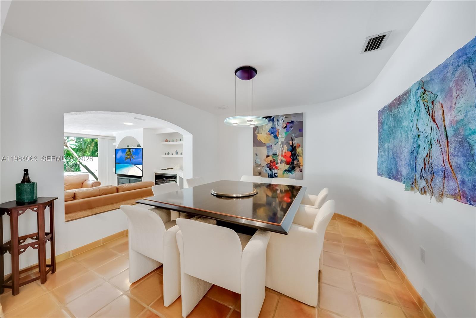 278 South Island Road Golden Beach, FL 33160 - Photo 17 of 57 a dining room with furniture and a window