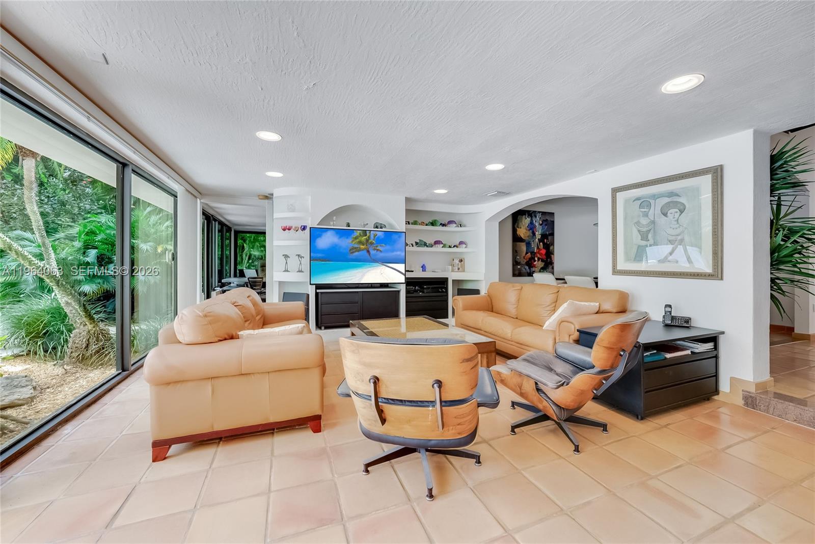 278 South Island Road Golden Beach, FL 33160 - Photo 22 of 57 a living room with furniture and a large window