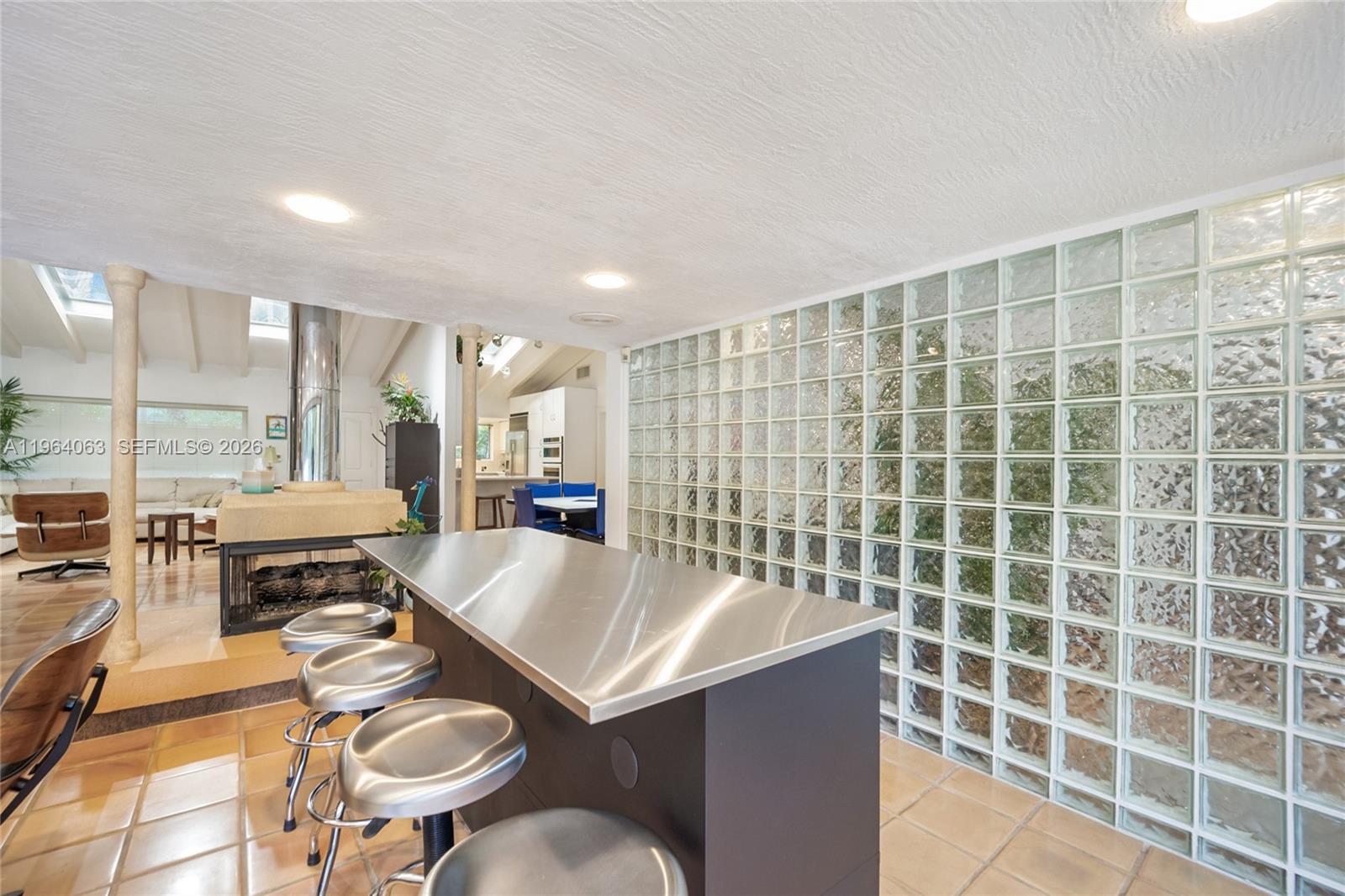 278 South Island Road Golden Beach, FL 33160 - Photo 23 of 57 a large kitchen with a sink and chairs