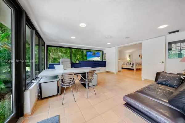 a view of a dining room with furniture window and outside view