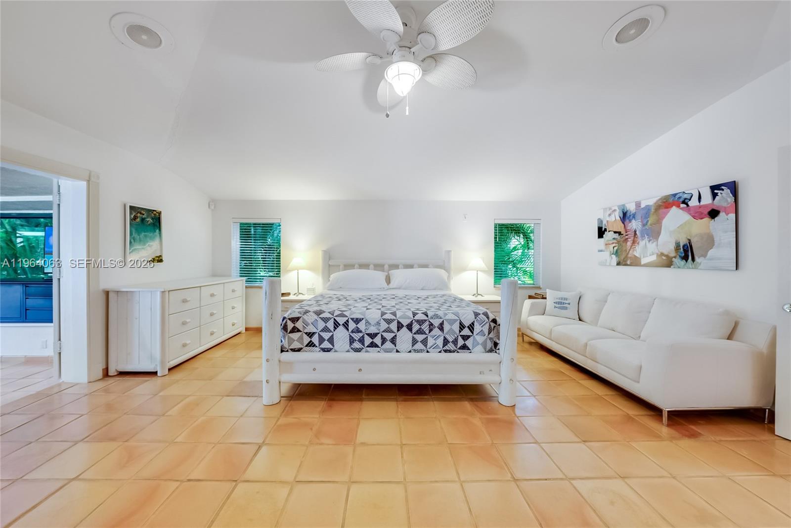 278 South Island Road Golden Beach, FL 33160 - Photo 37 of 57 a bedroom with a white bed and a couch