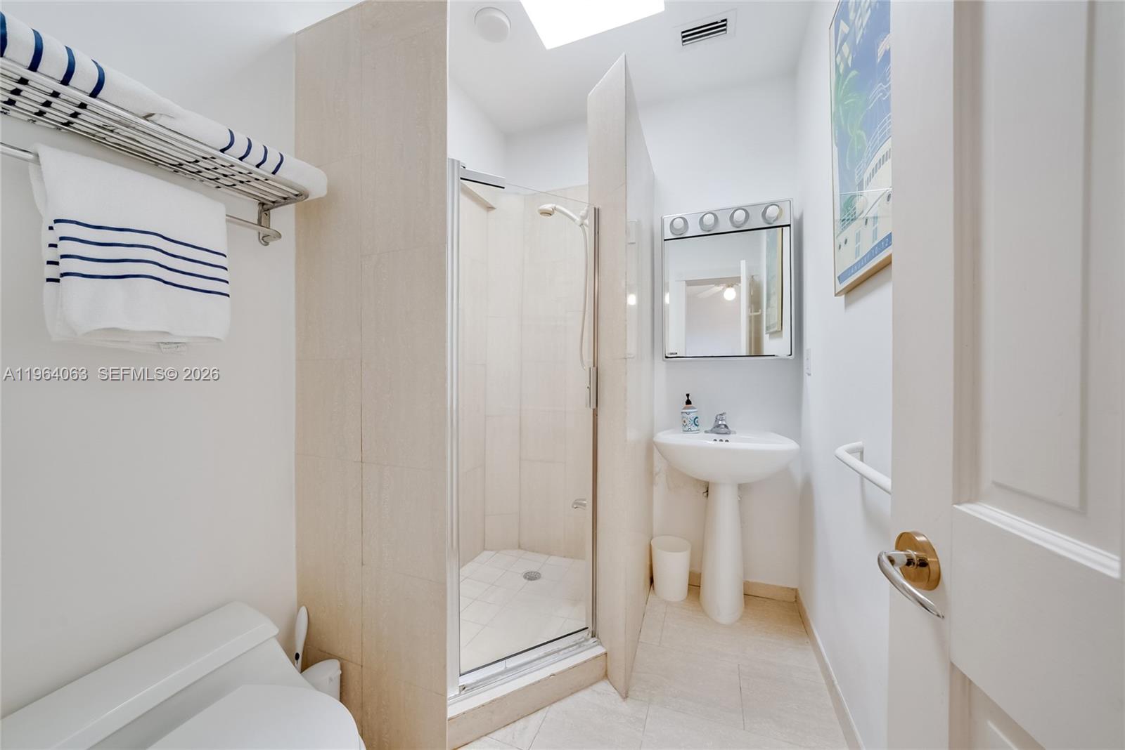 278 South Island Road Golden Beach, FL 33160 - Photo 43 of 57 a bathroom with a sink a toilet and shower