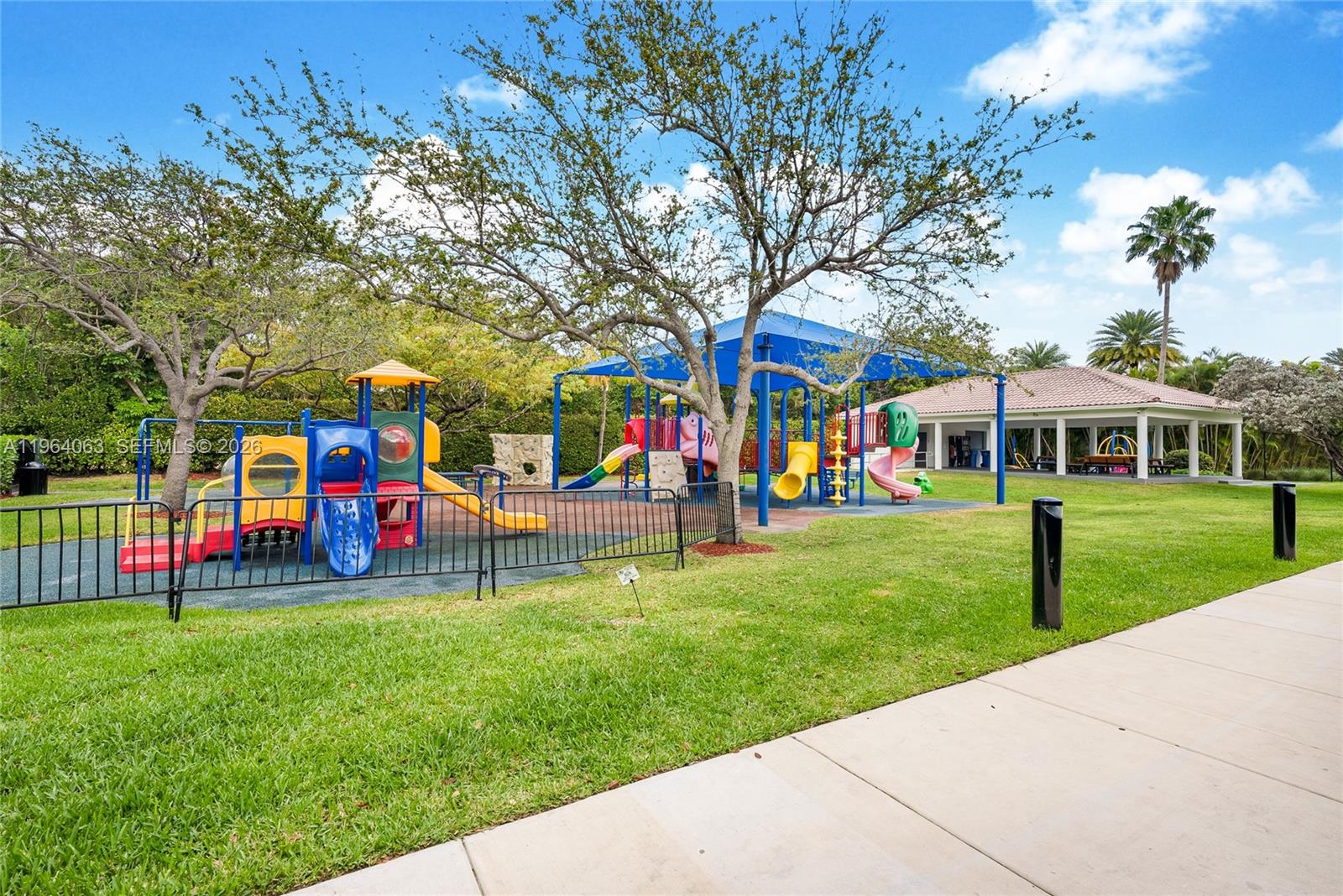 278 South Island Road Golden Beach, FL 33160 - Photo 56 of 57 a view of an house with a big yard and large trees