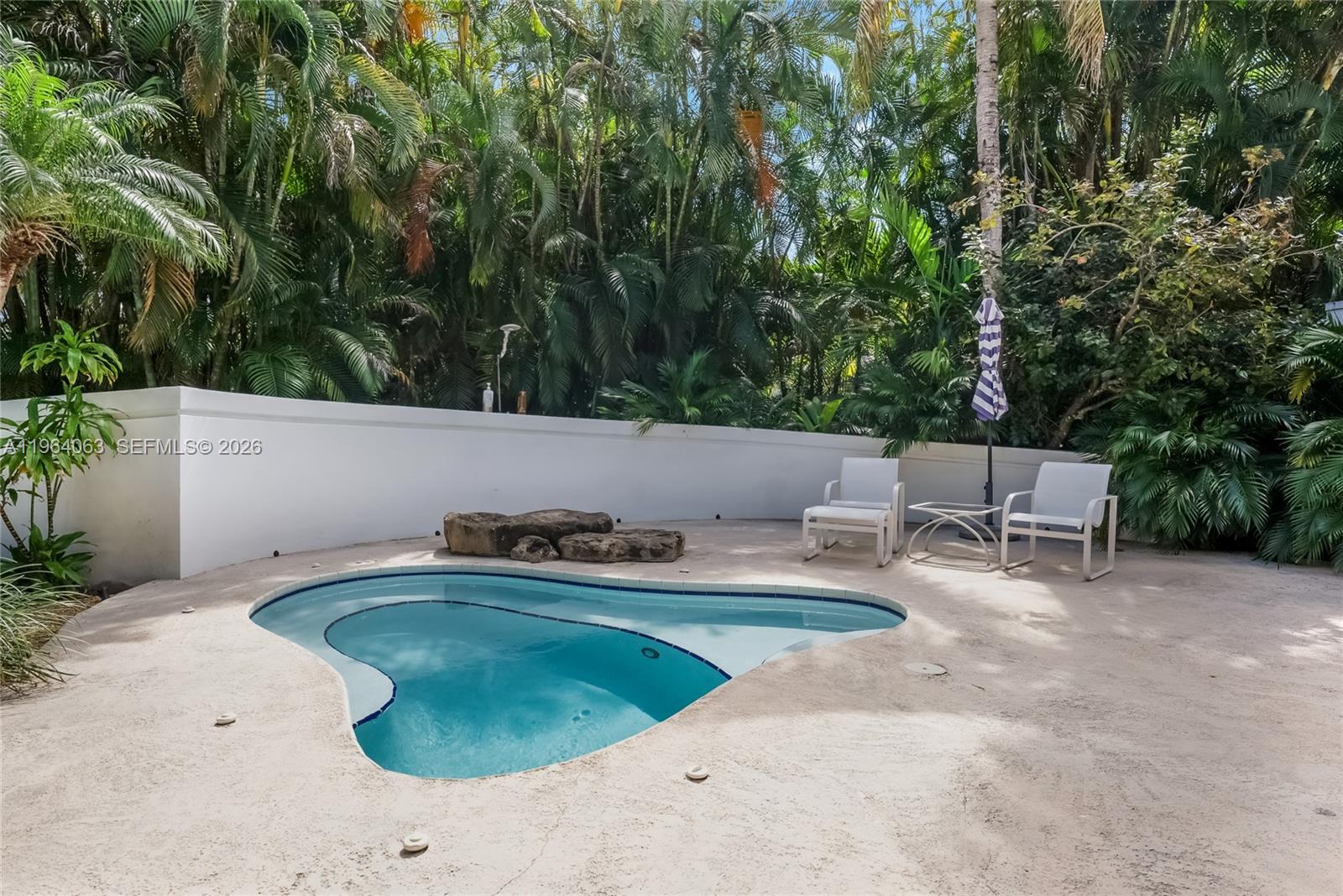 278 South Island Road Golden Beach, FL 33160 - Photo 8 of 57 a view of backyard with sitting area