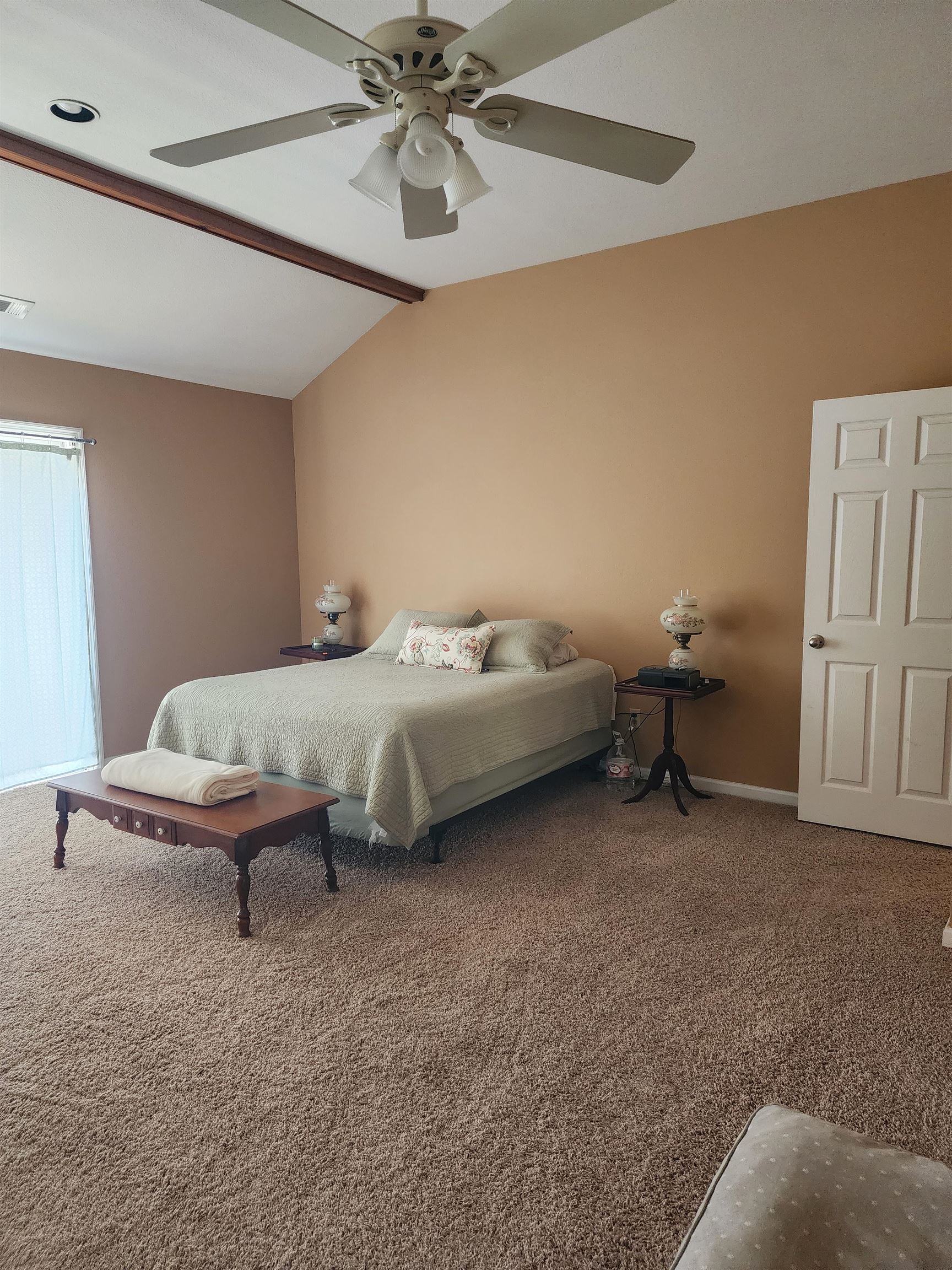 71 Chickasaw Trace Cherokee, AL 35616 - Photo 12 of 19 Spacious room featuring vaulted ceilings, a prominent ceiling fan, recessed lighting, neutral wall tones, and plush carpeting
