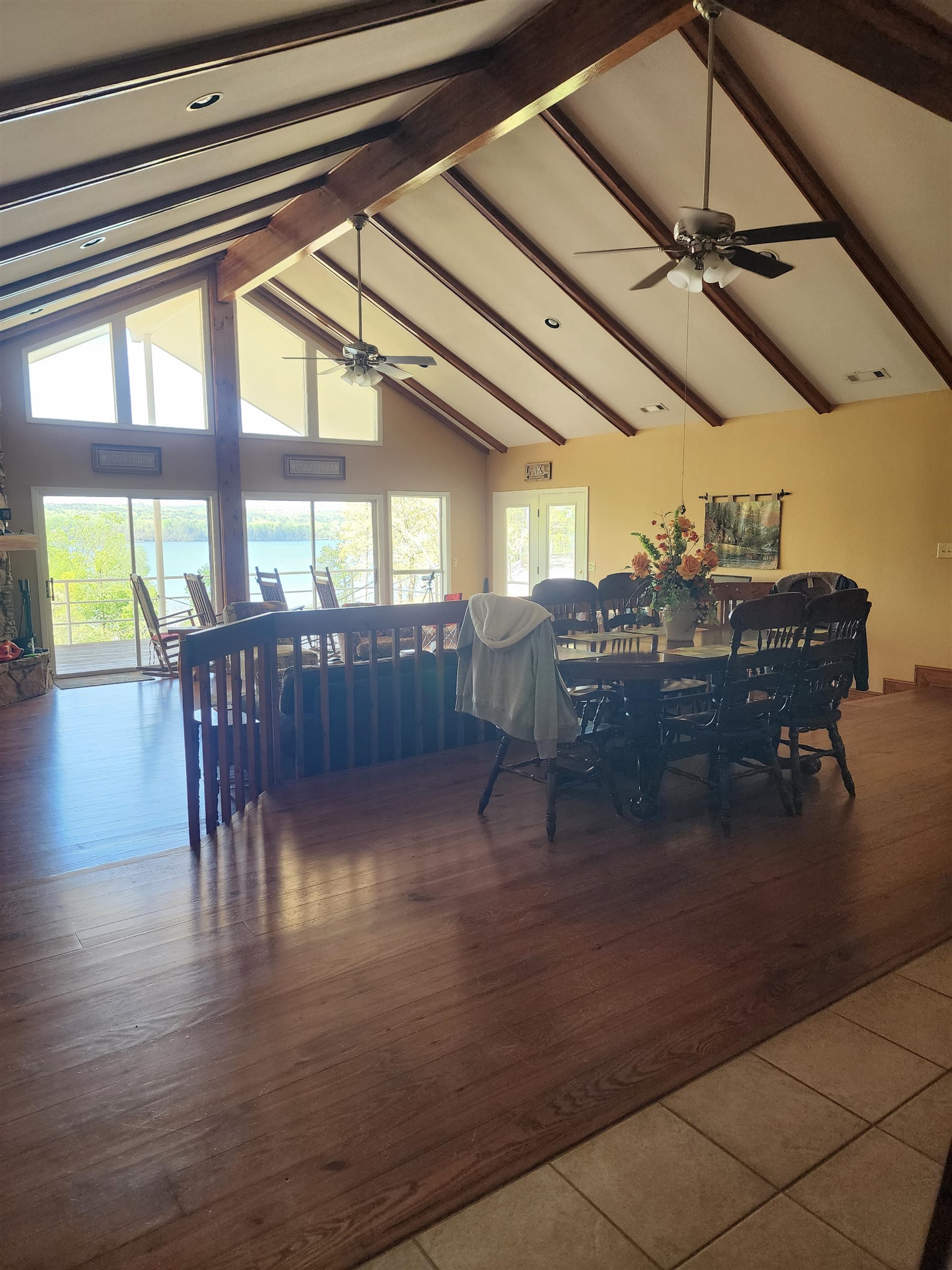 71 Chickasaw Trace Cherokee, AL 35616 - Photo 8 of 19 Vaulted ceiling with exposed wood beams, wood-finish flooring, and expansive windows offering outdoor scenery