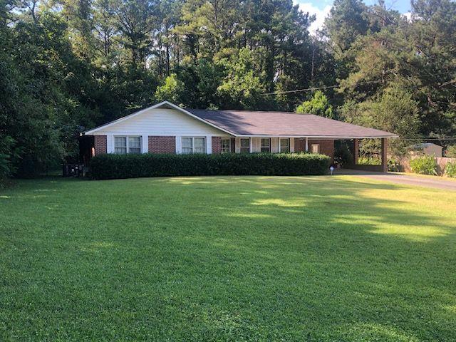 75 Westview Drive Northeast Cartersville, GA 30121 - Photo 1 of 1 a front view of a house with a yard