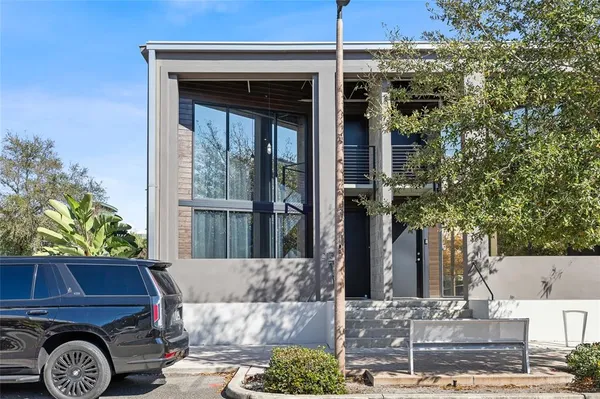 a front view of a house with parking area