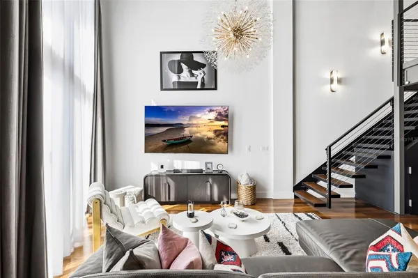 a living room with furniture and a flat screen tv