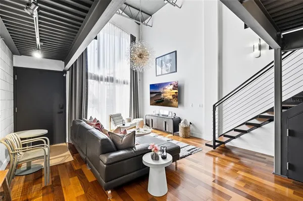 a living room with furniture and a flat screen tv