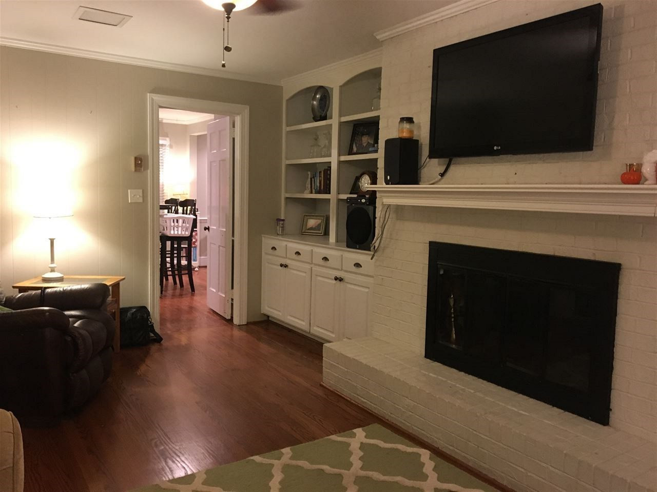 1101 Ivy Lane Raleigh, NC 27609 - Photo 5 of 25 Cozy family room with gas logs, custom built-ins and more hardwoods.