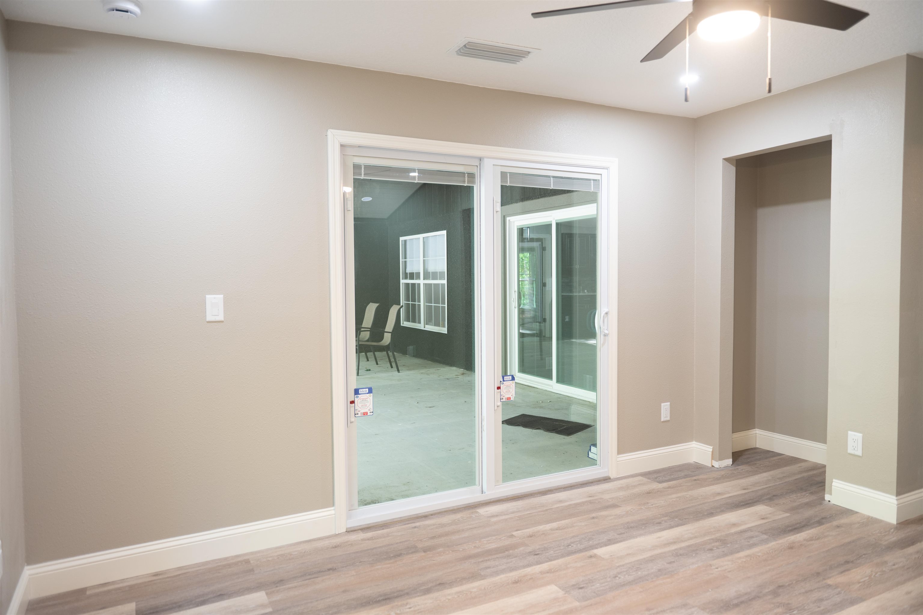 2950 Kings Road St. Augustine, FL 32086 - Photo 41 of 42 a view of a hallway with wooden floor and a bathroom