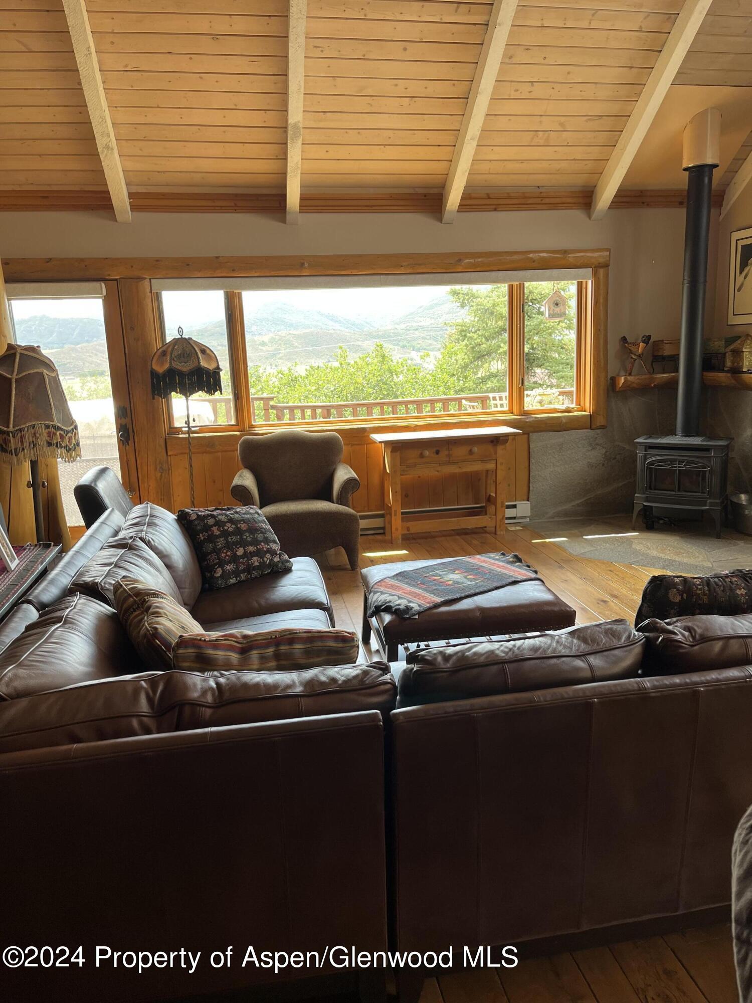 234 Light Hill Road Snowmass, CO 81654 - Photo 6 of 22 a living room with furniture pool table and large windows